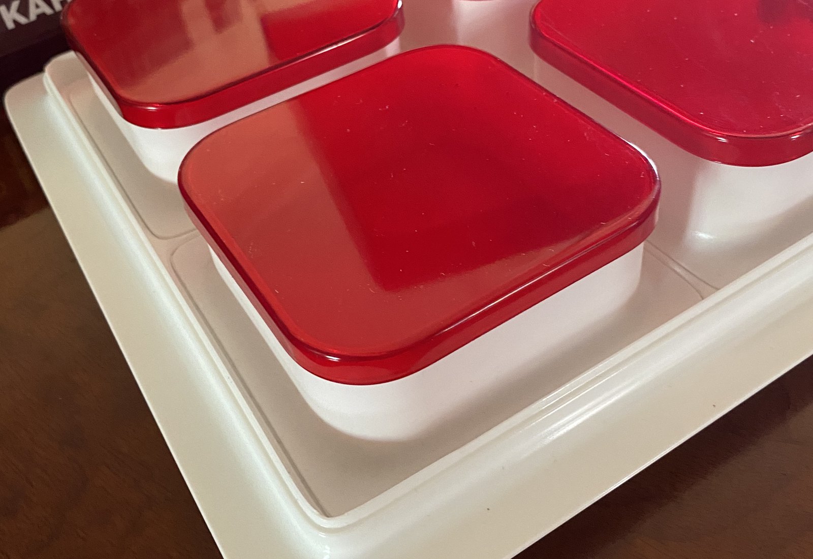 Retail kitchenware product detail showing molded plastic lids, radii and part relationships